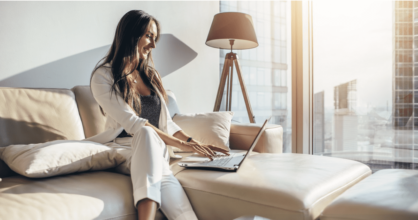 woman on couch with laptop